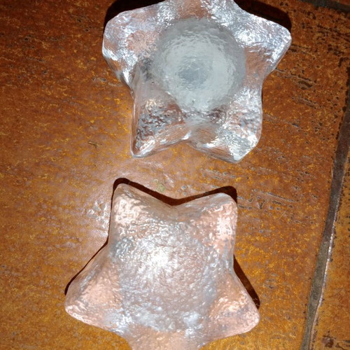 Solid glass embossed star candle holders used
