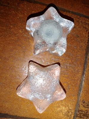 Solid glass embossed star candle holders used