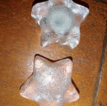 Solid glass embossed star candle holders used