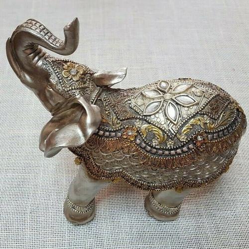 Handmade wooden elephant used with decorations and crystals