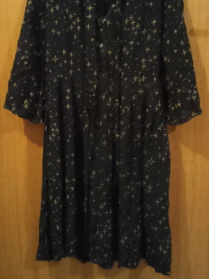 Black medium dress used with yellow stars and bow