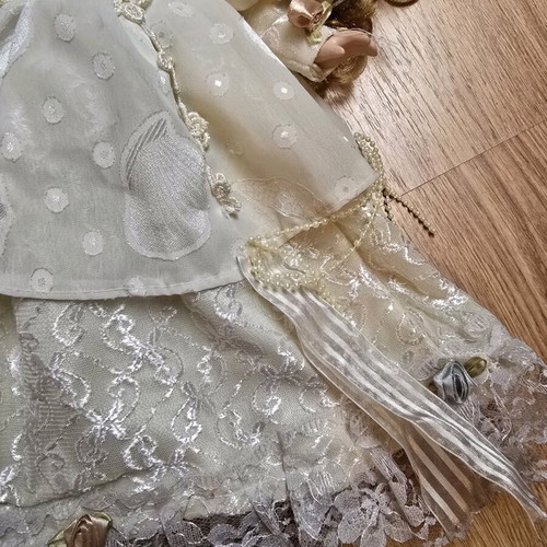 Glass Bride Doll like new with lace dress and hat