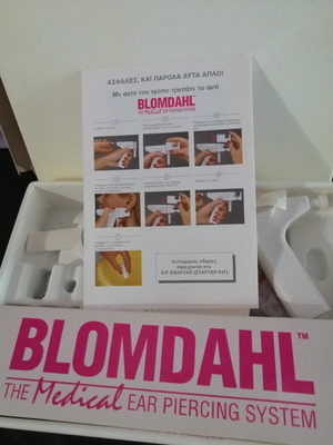 Ear piercing machine used with 2 replacement needles