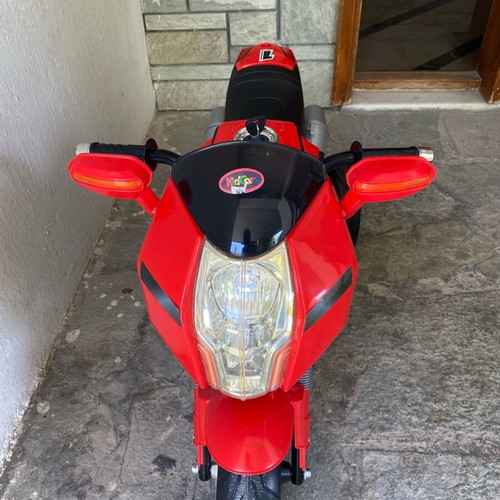 Electric children's motorcycle used with music