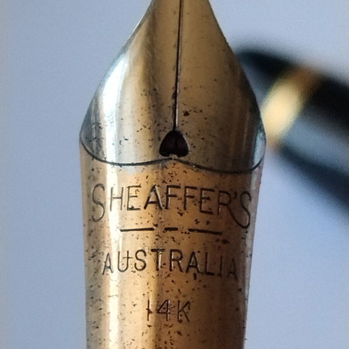 Sheaffer's vintage fountain pen set with 14K gold nibs and desk base, used