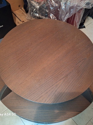 Coffee table used, round shape with storage compartments