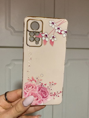 Pink phone case used with roses