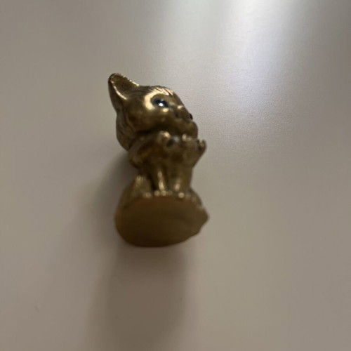 Vintage brass cat figurine with blue glass eyes like new