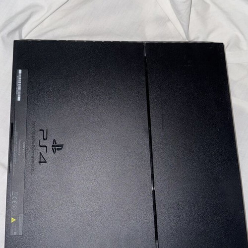 PlayStation 4 console with FIFA 19 and cables