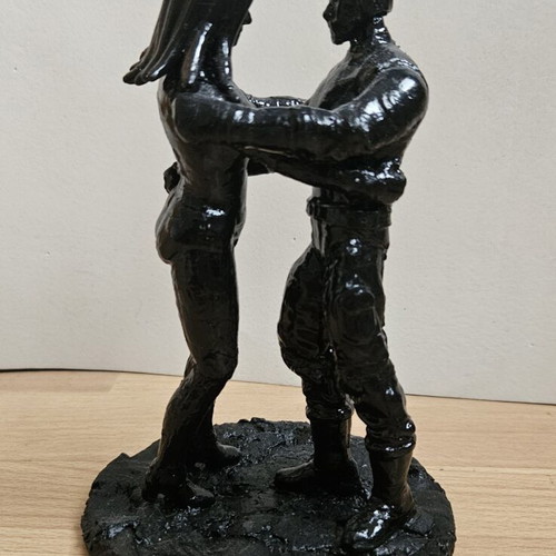 Handmade sculpture of embracing couple