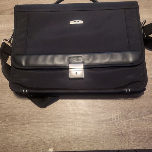 Delsey briefcase like new, black with multiple compartments