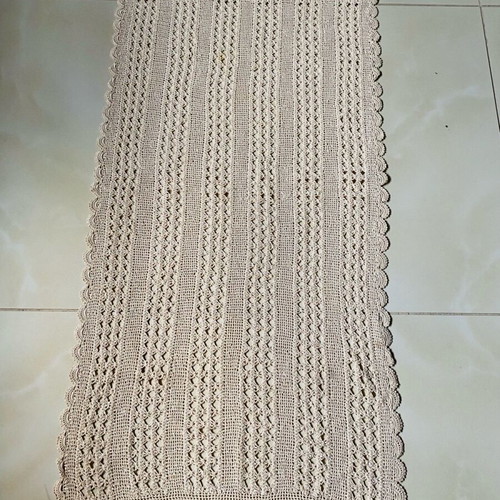 Handmade crocheted table runner used with cotton thread