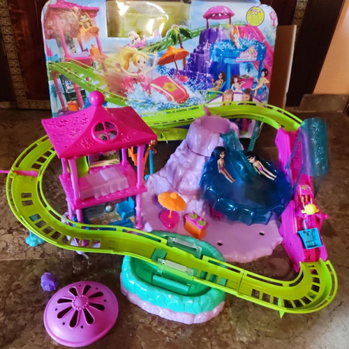 Polly Pocket Spin'n Surprise Waterpark playset used with 3 dolls and accessories