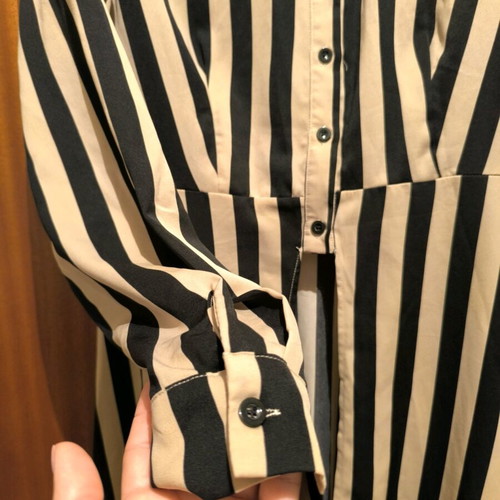 Women's shirt used with vertical stripes in beige and black