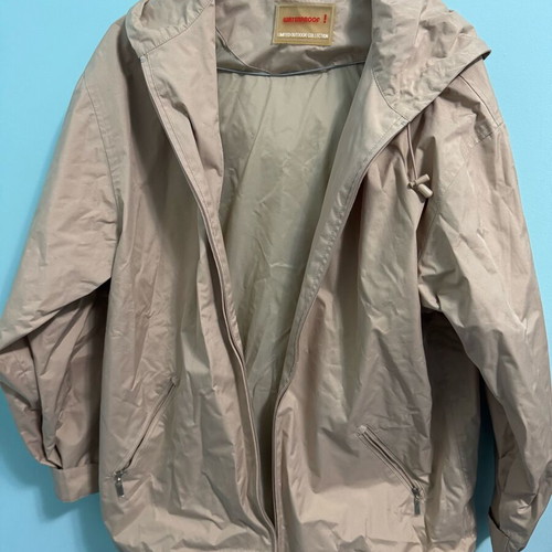 Lightweight waterproof jacket used, beige with hood, size M