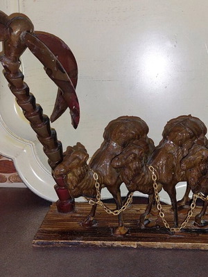 Decorative item used with camels and palm tree made of wood and plastic