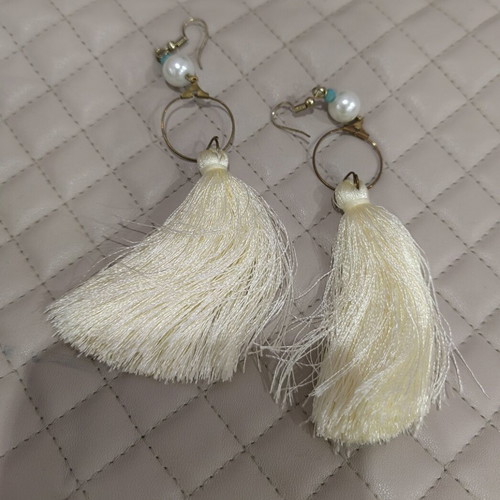 Earrings used with white tassels