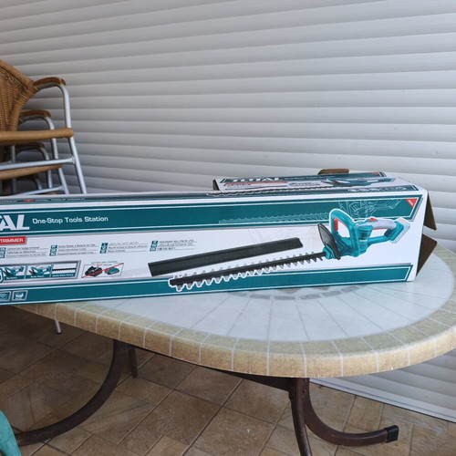 Total cordless hedge trimmer with battery and charger