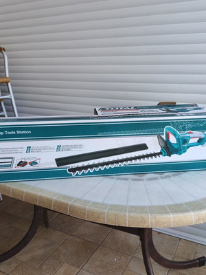 Total cordless hedge trimmer with battery and charger