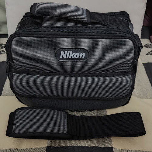 Nikon camera bag like new with shoulder strap and multiple compartments