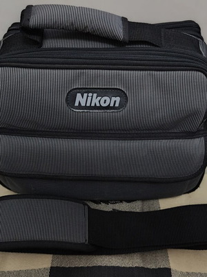 Nikon camera bag like new with shoulder strap and multiple compartments