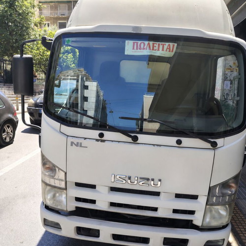 Isuzu truck 2012 used with open cargo bed, ready for work