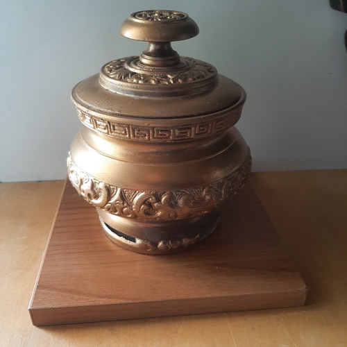 Vintage metal vessel with wooden base used, decorative aroma container