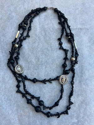 Necklace with three strands like new, black plastic beads