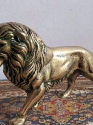 Solid bronze lion sculpture