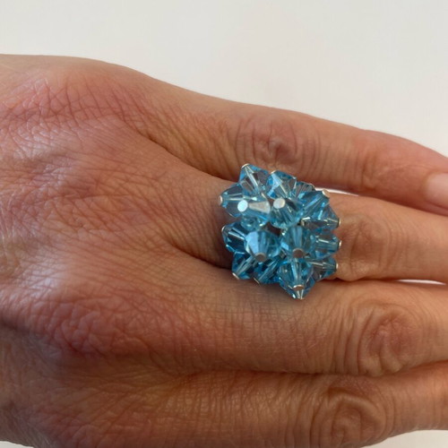 3D ring with bright blue moving crystals like new