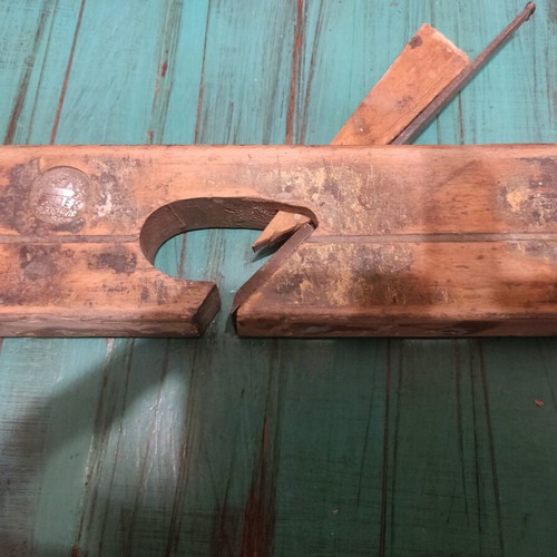 Wooden plane used with signs of wear, about 25 centimeters