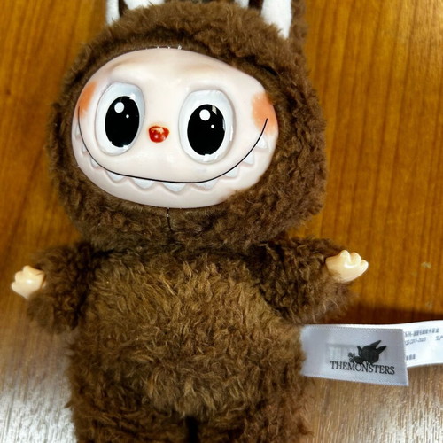 Labubu used brown figure from Pop Mart Monsters series