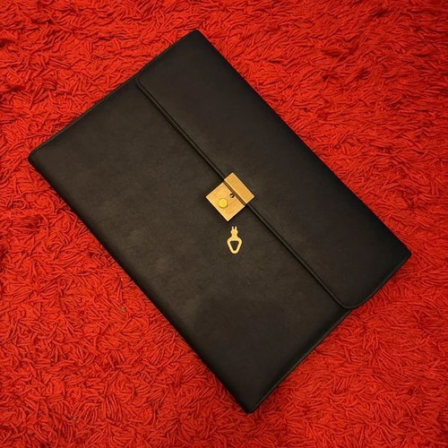 Clutch used, black with gold clasp, leatherette material