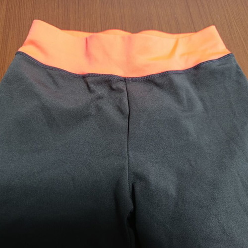 Women's 3/4 leggings anthracite with orange details used, size M