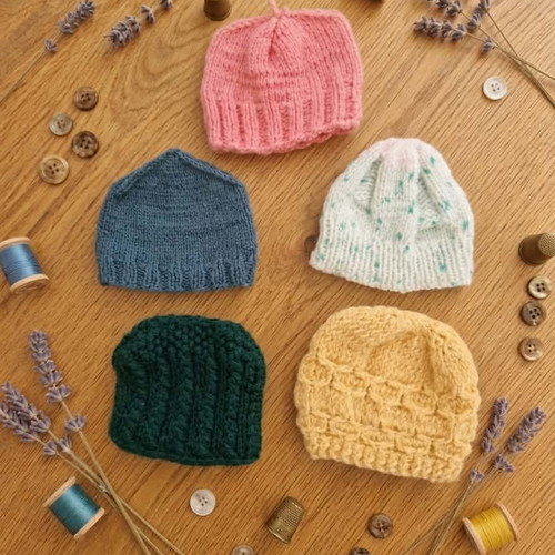 Handmade knitted doll clothes in various colors