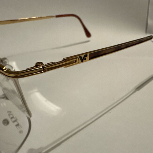 Oval Vogue optical glasses with tortoise details and gold frame, new