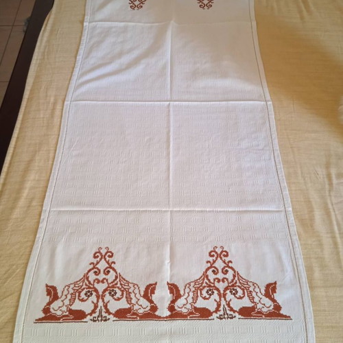 Handmade white embroidered table runner tzevres in terracotta-brown shades