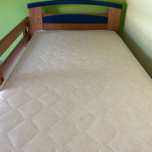 Wooden bunk bed with third sliding bed and mattresses like new