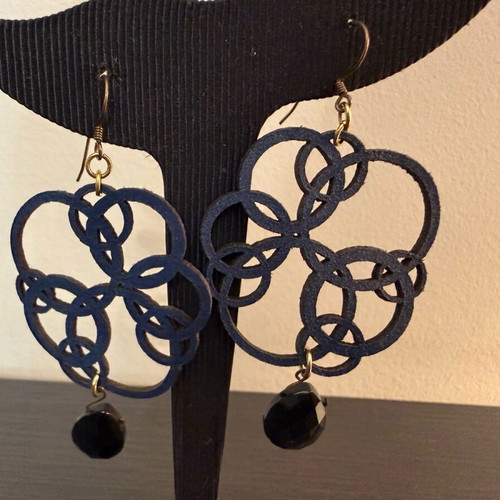 Earrings with blue laser cut leather flower design like new