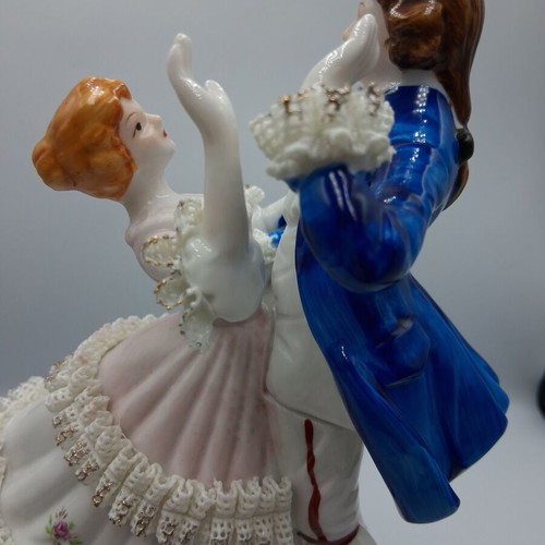 Vintage porcelain music figurine of dancing couple, like new
