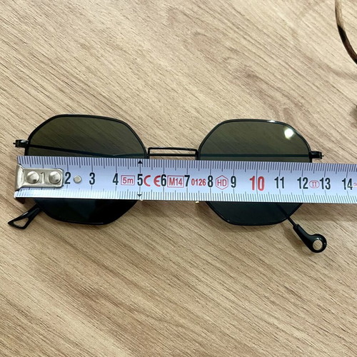 Polygonal statement sunglasses with asymmetrical design and strap
