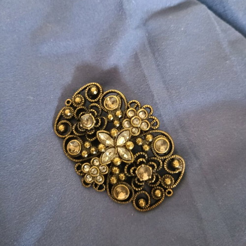 Vintage brooch used with filigree design and gold finish