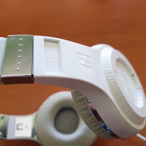Bluetooth headphones used, white with MP3 and memory card options