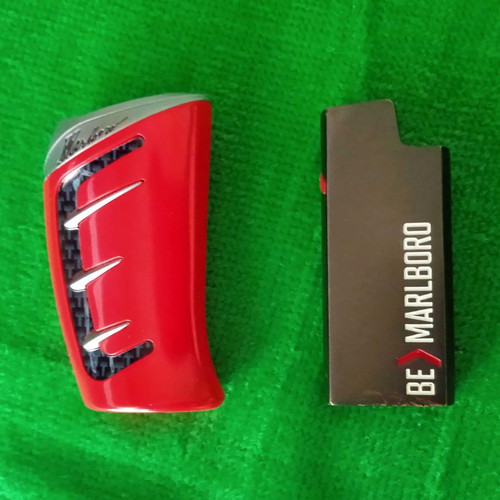 Marlboro pack used with metal cigarette case and lighter holder