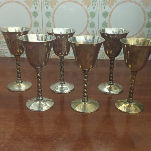 Silver-plated liqueur glasses used with some wear