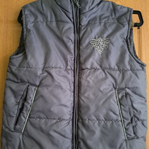 Children's vest like new, size 128 cm, gray with pockets