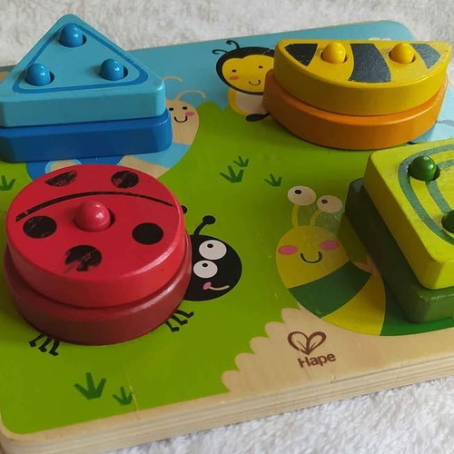 HAPE wooden sorting toy used with colors and shapes