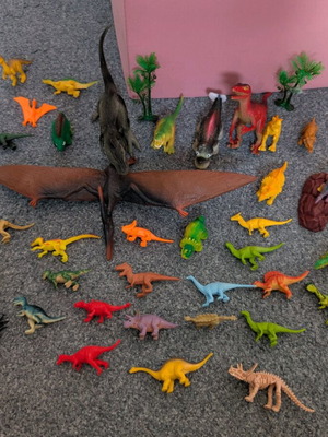 Plastic dinosaurs used, pack of 30 small and 3-4 large