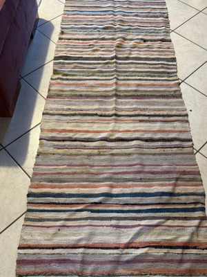 Rug used 2.80x0.78 m with hole and wear on the side