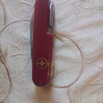 Multitool pocket knife like new with saws, screwdriver, scissors, and more